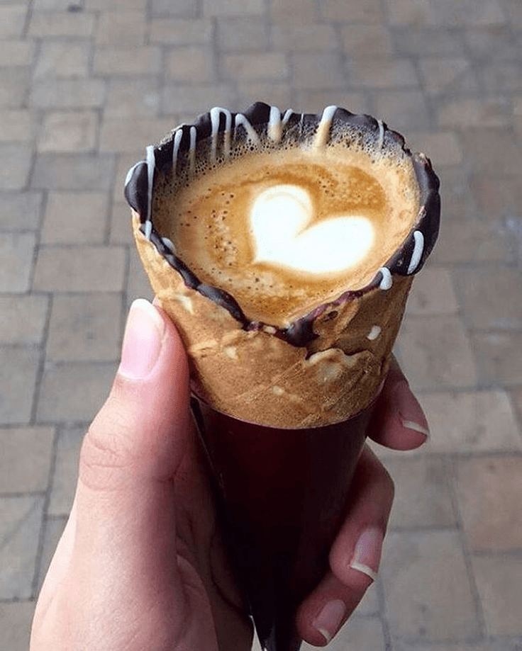 Latte served in a chocolate-dipped edible cone